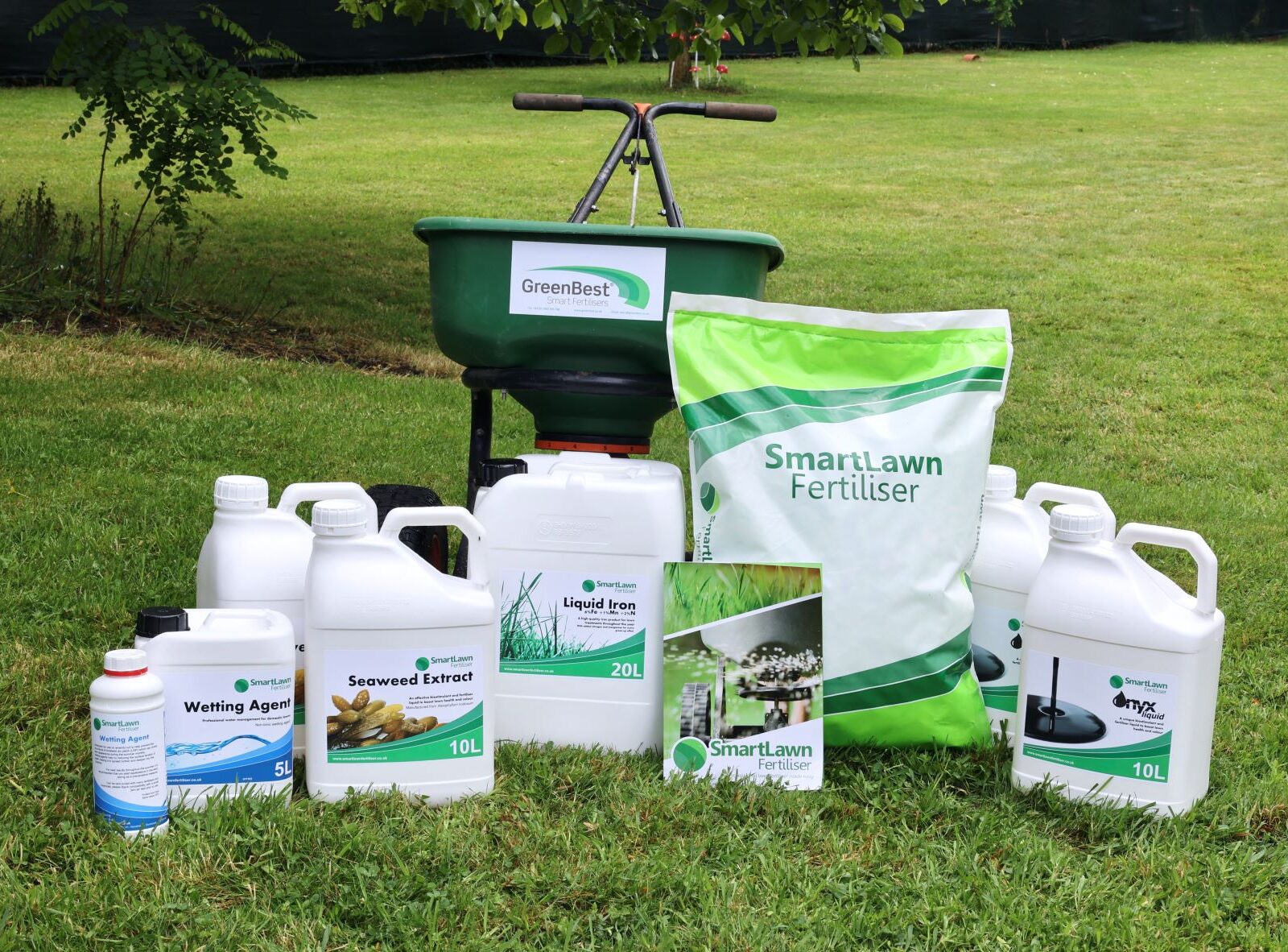 SmartLawn Fertiliser products on a lawn with a fertiliser spreader